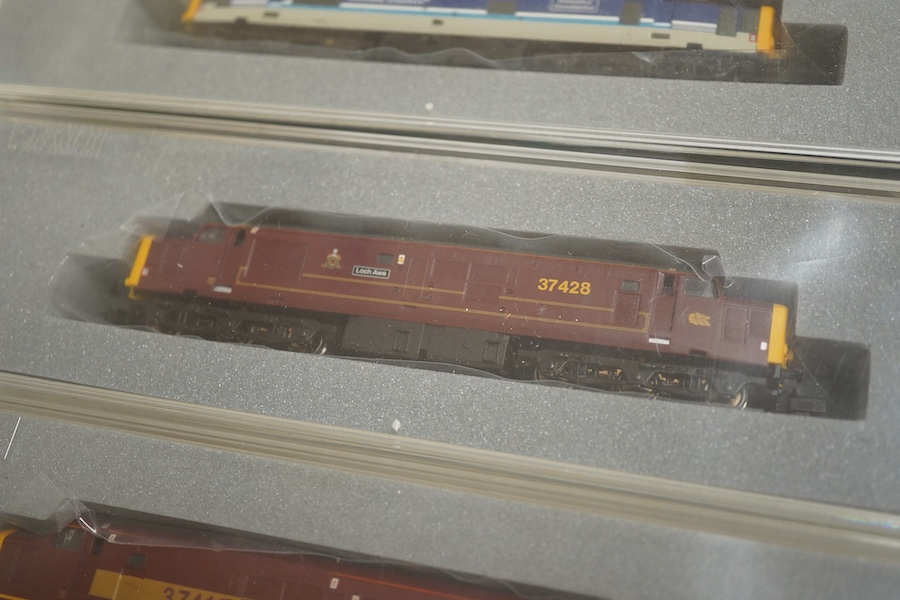 Three boxed Graham Farish N gauge railway Class 37/4 Co-Co diesel-electric locomotives; a Scottish EWS, Loch Awe (371151), a Regional Railways, Eisteddfod Genedlaethol 37429 (371154), and an EWS, 37419 (371153).